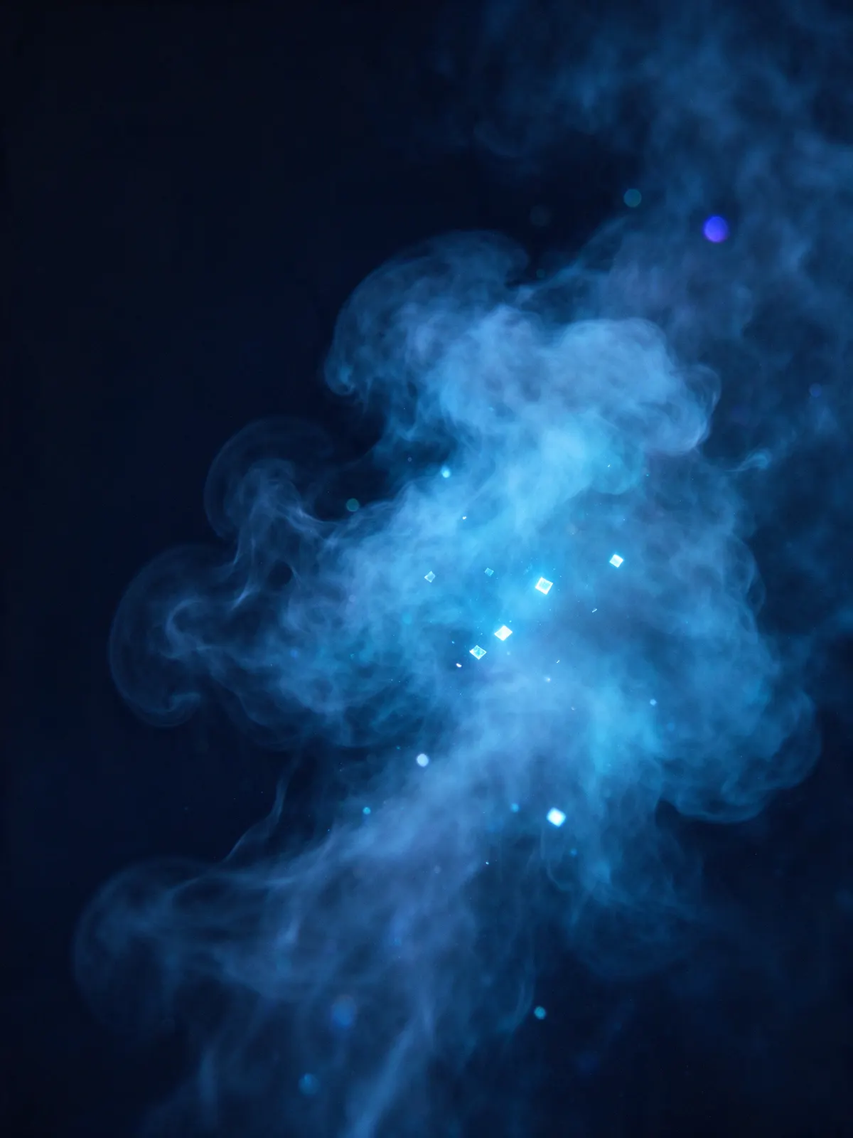 A soft, glowing blue cloud of mist with a few small points of light forming inside it.